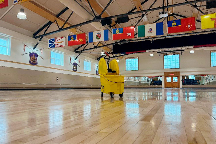 The hardwood floors at Depot being mopped.