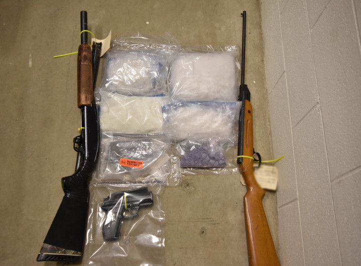 Three firearms (a pump action shot gun, a rifle and a handgun) as well as six bags of what is believed to be controlled/ illicit drugs.