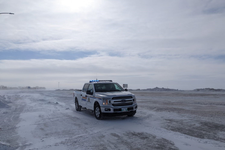 Photo of RCMP truck parked alongside Highway 75