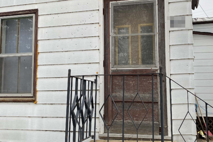 Bullet holes in front of home