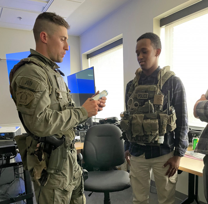 Spend a Day with an RCMP Recruiter: Participants got a chance to try on parts of the Emergency Response Team's specific uniform. 