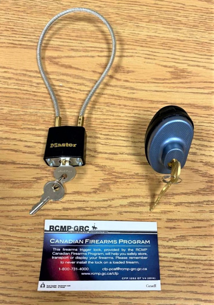 Two trigger locks are pictured with keys. A RCMP card with the Canadian Firearms program contact information is also pictured, 1-800-731-4000, cfp-pcaf@rcmp-grc.gc.ca, rcmp.gc.gc.ca/cfp .