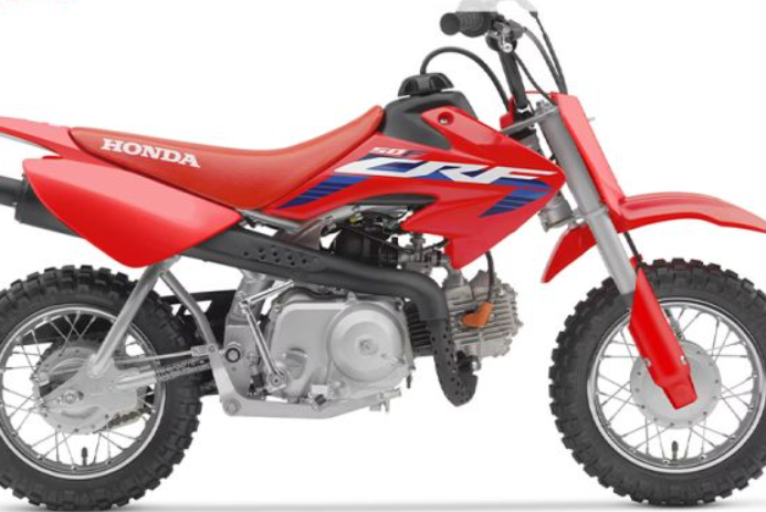 A stock image of a 2022 Honda CRF-50 dirt bike which is red in colour.