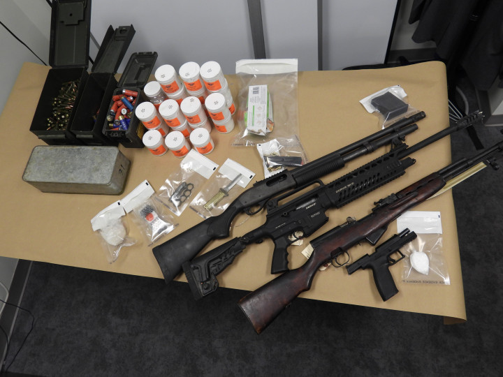 Seized three long guns, a handgun with a loaded magazine, approximately 28 grams of crack cocaine and drug trafficking paraphernalia.