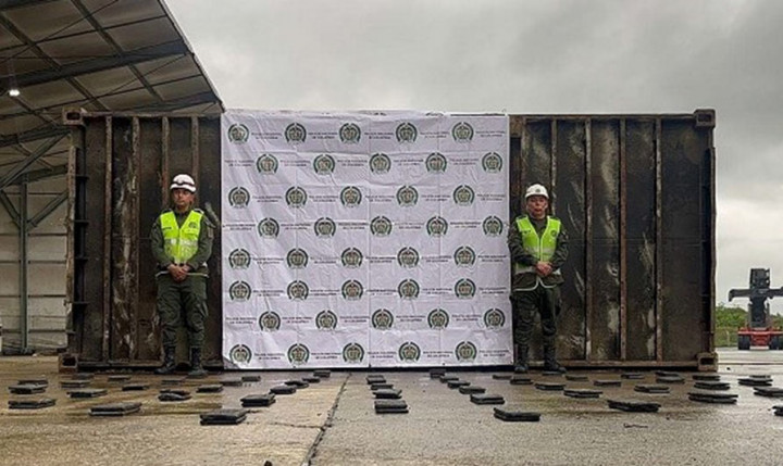 Colombian authorities with seized cocaine