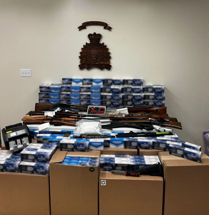 approximately 110,000 illegal cigarettes; one kilogram of morphine powder; eight firearms, including a semi-automatic model; magazines for the semi-automatic firearm; ammunition; and trafficking paraphernalia.