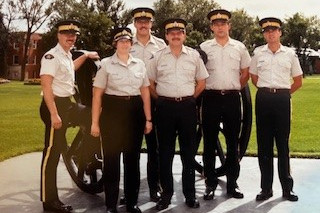 Ruby Burns, as a young constable stands with other RCMP members. 