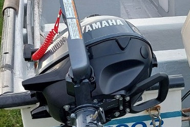 A black 2.5 hp Yamaha outboard motor.