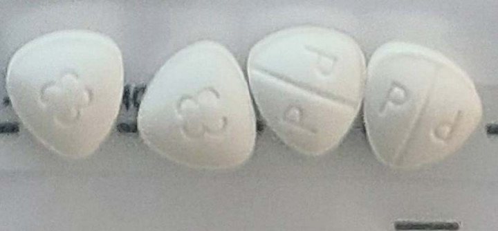 4 white triangular shaped pills with rounded corners etched with p-d on one side a 3 3 on the other