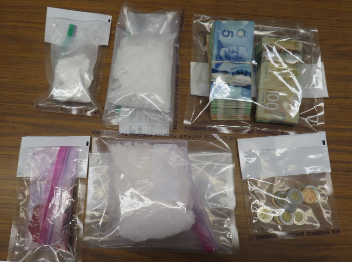 503 grams of methamphetamine; 52 grams of fentanyl; 105 grams of cocaine; trafficking paraphernalia; and a sum of cash.