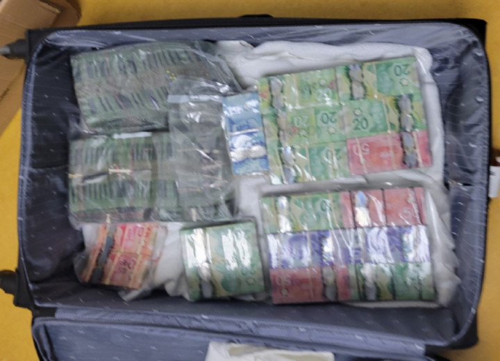 photo of suitcase with cash