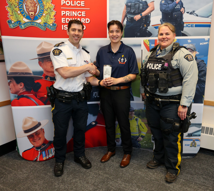 Chief Superintendent Kevin Lewis (left), Darcie Augustine and Constable Amy Handrahan